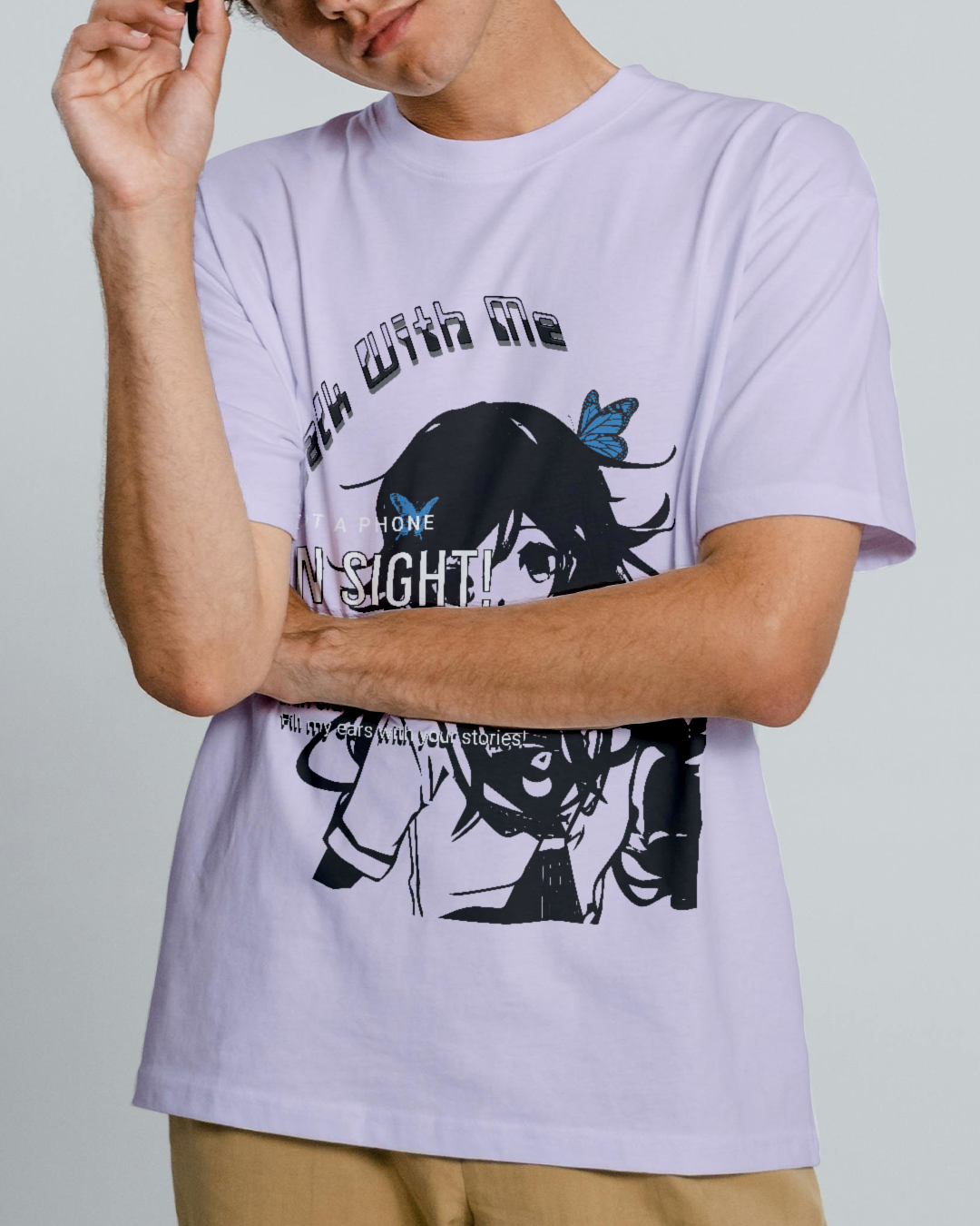 Person wearing a lavender t-shirt with graphic design and text